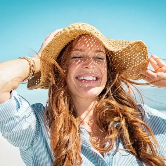 A woman looking happy in the summer months